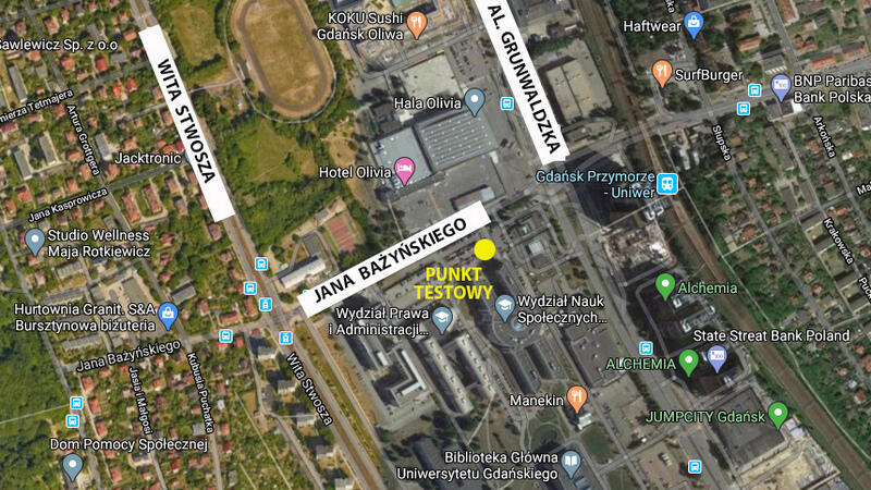 Mapa google fragmentu miasta, na którym żółta kropką zaznaczono centrum testowe 