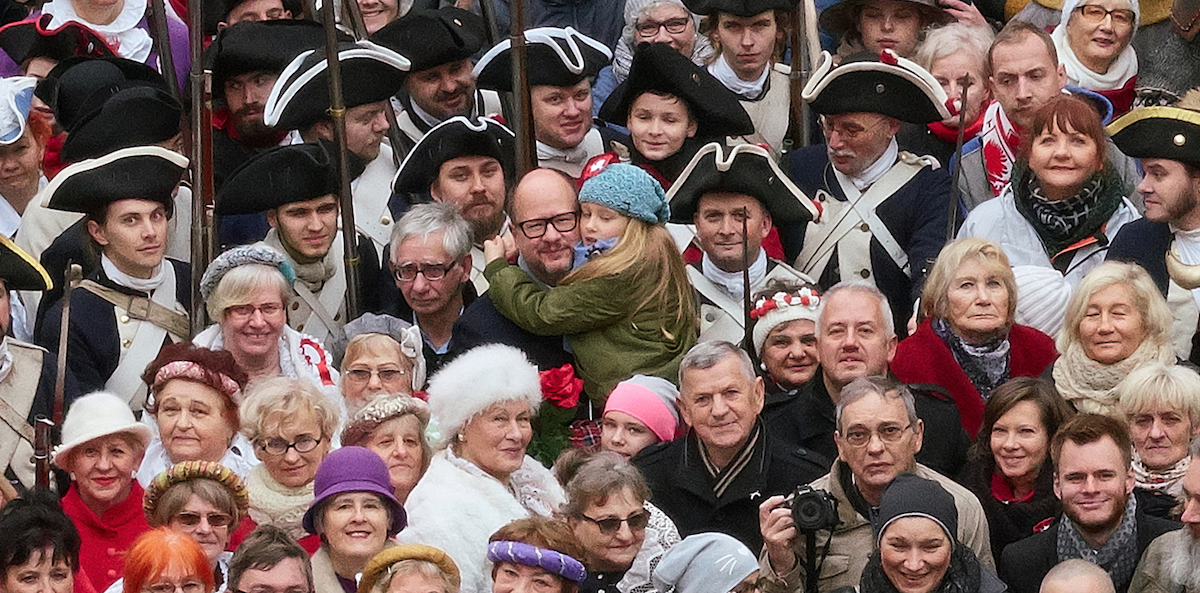 Paweł Adamowicz with his younger daughter Tereska in the Long Market at the Gdańsk Family Photo session. The event accompanied the Independence Day parade on the centennial of Poland’s independence, 11 November 2018